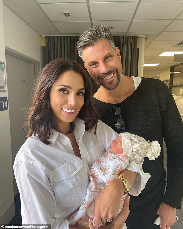 The Bachelor star, 43, told Body and Soul that his youngest child suffered an infection shortly after her birth in May 2022, which took a toll on his mental state.  Pictured: Sam and Snezana Wood with their daughter Harper in 2022