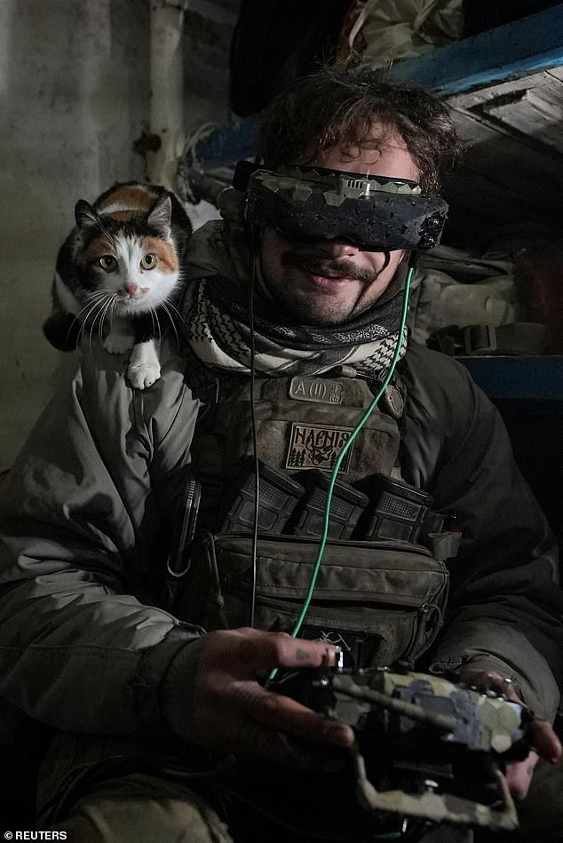 A Ukrainian soldier from the Rarog UAV squadron of the 24th Separate Mechanized Brigade operates a first person view (FPV) drone at a position near the town of Horlivka