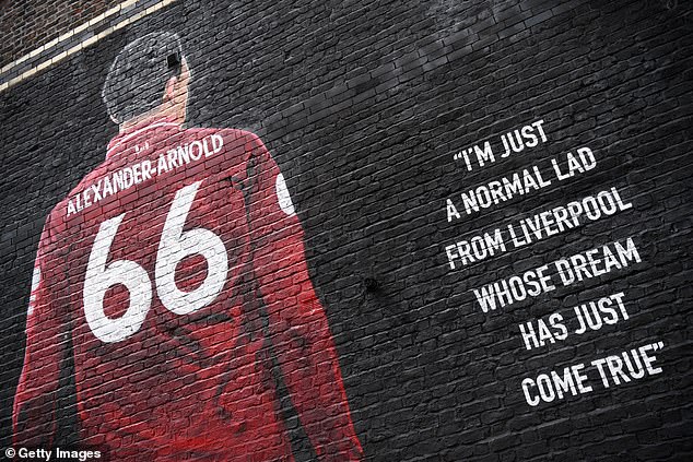 The Liverpool star is pictured on a mural on Sybil Road, just outside Anfield