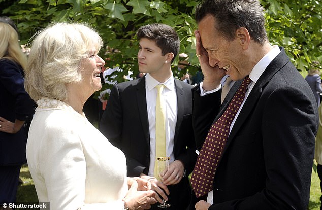 Actor Richard E Grant groans as he talks to Camilla at a garden party celebrating the 25th anniversary of the National Osteoporosis Society in 2011. The two know each other well, but the Queen has been keeping an eye on her boyfriend in his latest venture, the very daring Saltburn ?