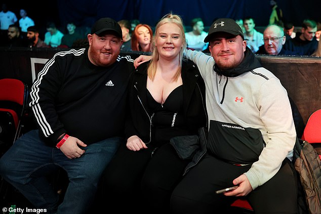 Littler's partner is five years older than him and couldn't go to the Middle East with him, but celebrated by going to the boxing match on Saturday evening