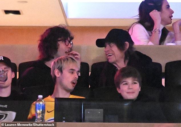 The Rolling Stones legend, 80, cut a low-key figure in a black baseball cap as he was joined by his youngest son Lucas, 24