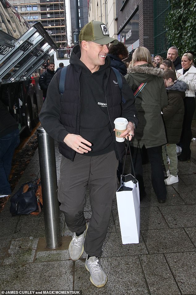 Kai Widdrington beamed as he made his way through the crowd of fans while holding a cup of coffee