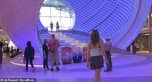 Jo is pictured here taking in the Icon's Pearl feature - a giant, walk-through three-deck sphere installation