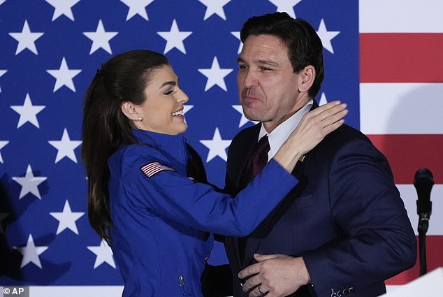 Casey and Ron DeSantis embrace during a caucus night party on Monday, January 15, in West Des Moines, Iowa, after the governor finished in second place in the first primary state