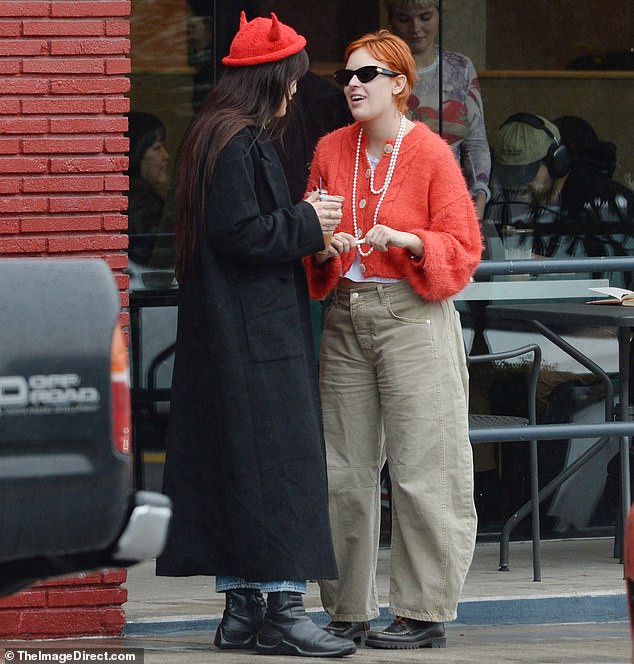 Tallulah, 29, opted for a bright red cardigan sweater contrasted with a bright white T-shirt