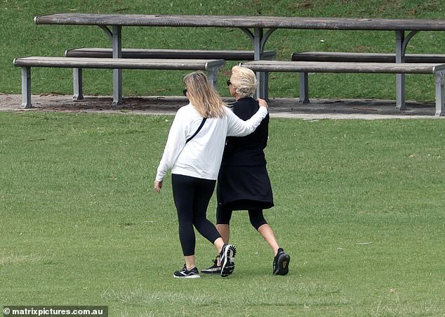 At one point, Deborra-Lee's friend put an arm around her shoulders