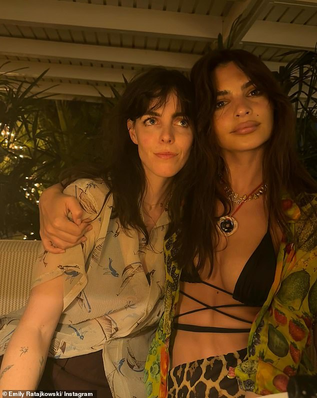 Another photo, believed to be from the same evening, showed Ratajkowski in the same look sans headband as she posed next to her friend