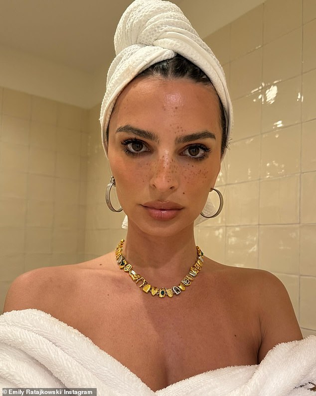 One of the photos from her series was a post-shower selfie, showing her with her hair in a towel and a bathrobe off her shoulders.  In the snap, she showed off her sun-kissed skin, sultry makeup and statement jewelry