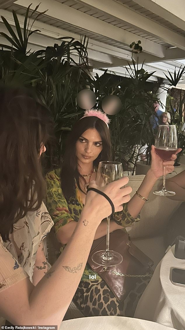 She also shared another photo of herself at dinner wearing the pink headband with the caption: 