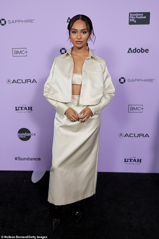 Daniella Taylor - best known for Freeform's Grown-ish and Nickelodeon's Knight Squad - wore a cream bra top under a matching cropped jacket, maxi skirt and patent leather platform boots