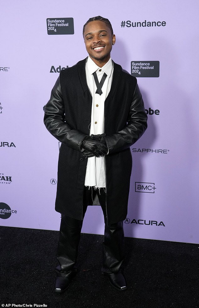 Rapper-actor Amarr – who plays Nate – looked sharp in a long black coat, matching leather trousers, gloves, boots and a white crisp button-down