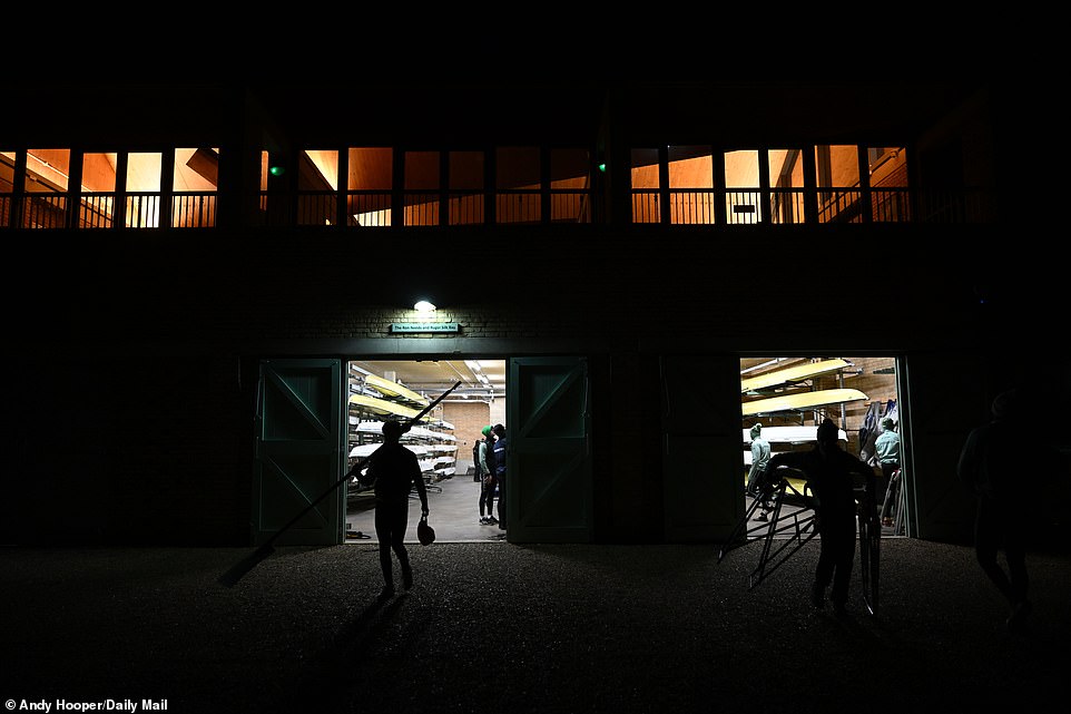 In pitch darkness, crew members carried equipment to the water's edge as they ramped up preparations for the March event