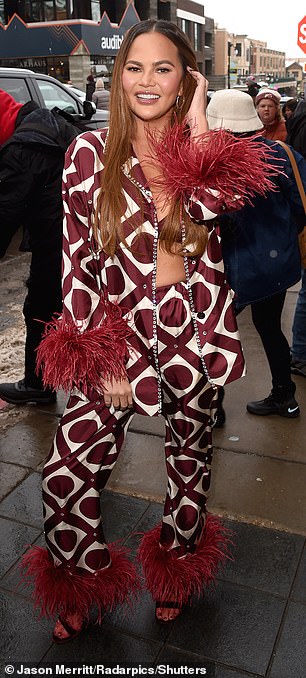 1705908625 799 Chrissy Teigen looks fabulous in feather trimmed boho inspired suit at Sundance