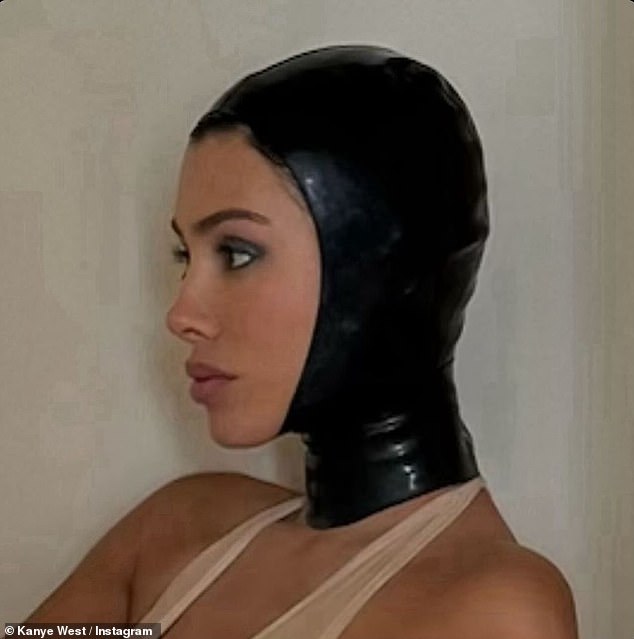 The scandalous snaps were posted to Instagram on Saturday morning and showed his 29-year-old Australian wife wearing a nude one-piece thong and a bizarre leather mask.