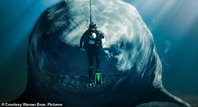 In the Meg film franchise, the megalodon shark is depicted as a gigantic, monstrous beast that can race through the waters towards unsuspecting victims