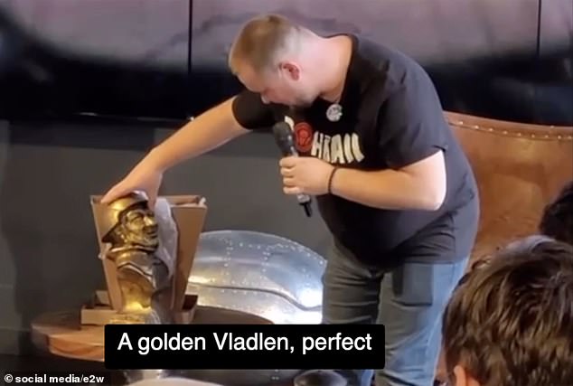 Vladlen Tatarsky, 40, is seen with the small statue in a cafe in St. Petersburg just before the explosion