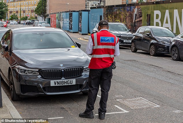 Failure to park within the white lines of a conventional on-street parking space in a city (such as this one in London) can result in a fine for motorists