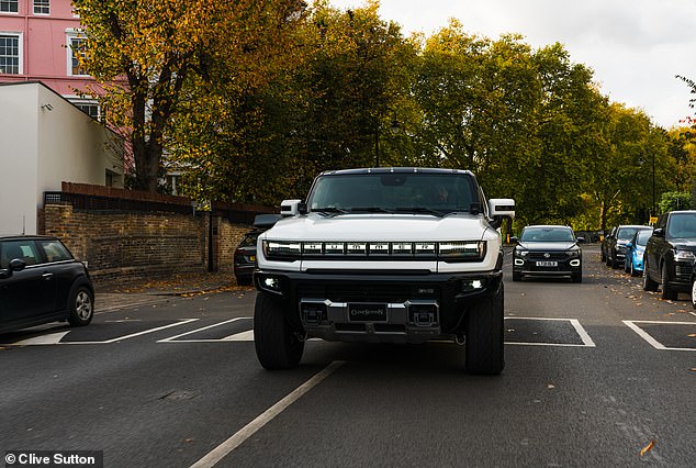 This colossal Hummer EV is 2.3 meters wide.  It dwarfs the conventional cars sold in Britain and looks huge on the busy streets of London (pictured)