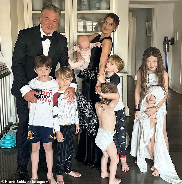 The couple posed with their seven children: Carmen Gabriela, 10, Rafael Thomas, eight, Leonardo Angel Charles, six, Romeo Alejandro David, five, Maria Lucia Victoria, two, Eduardo Pao Lucas, two, and Ilaria Catalina Irena, 11 months