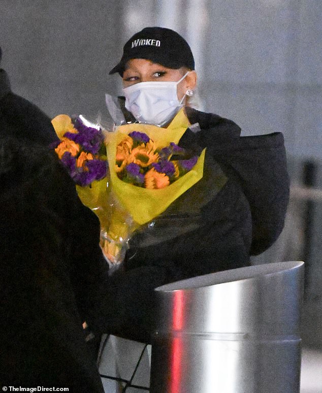 She held the bouquet close to her