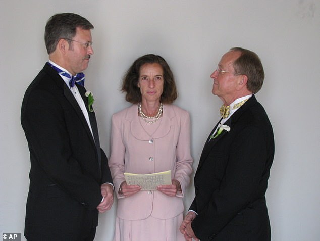 Mark Andrew, left, and Bishop V. Gene Robinson are shown during their private civil union ceremony performed by Ronna Wise in Concord, NH, on Saturday, June 7, 2008.