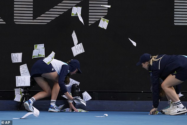 A woman threw leaflets at the Margaret Court Arena during the fourth round of the Australian Open on Monday