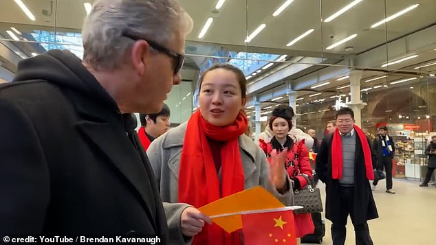 The woman (pictured) told him she worked for Chinese TV and asked if they were in view of his camera, then said 'not allowed'.