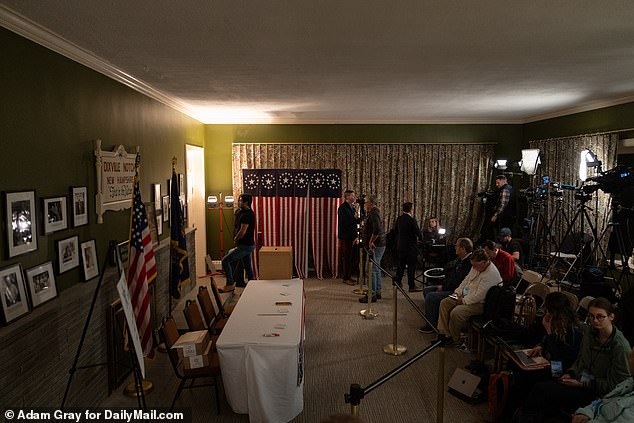 Journalists gather before midnight to watch the historic count of the nation's first primary elections in the small town of Dixville Notch in northern New Hampshire