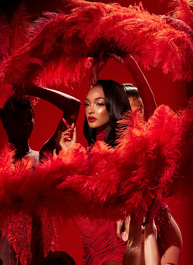 She kept the bright red lip as she posed for another stunning photo