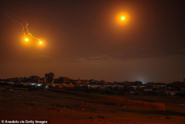 Flares fired by Israeli forces can be seen above the skies in several parts of Deir Al-Balah city, Gaza, as the Israeli army's air, sea and land attacks on the Gaza Strip continue uninterrupted on January 22.