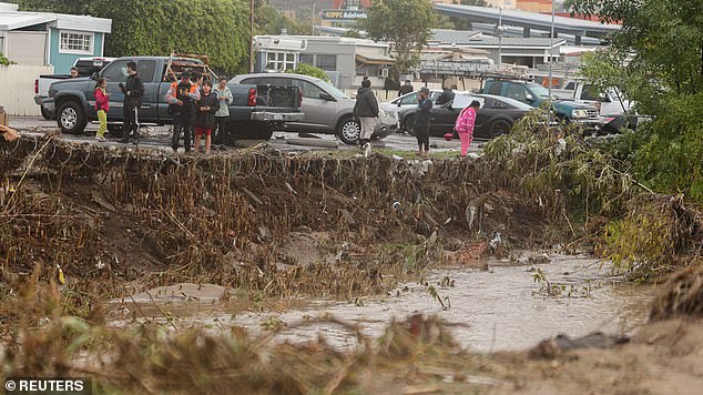 Damage becomes visible after a heavy rainstorm causes a small river to flood into a San Diego neighborhood