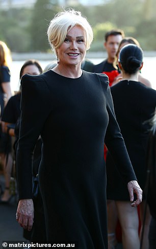 The 68-year-old looked every inch a major movie star in a figure-hugging black dress with stylish square shoulder pads