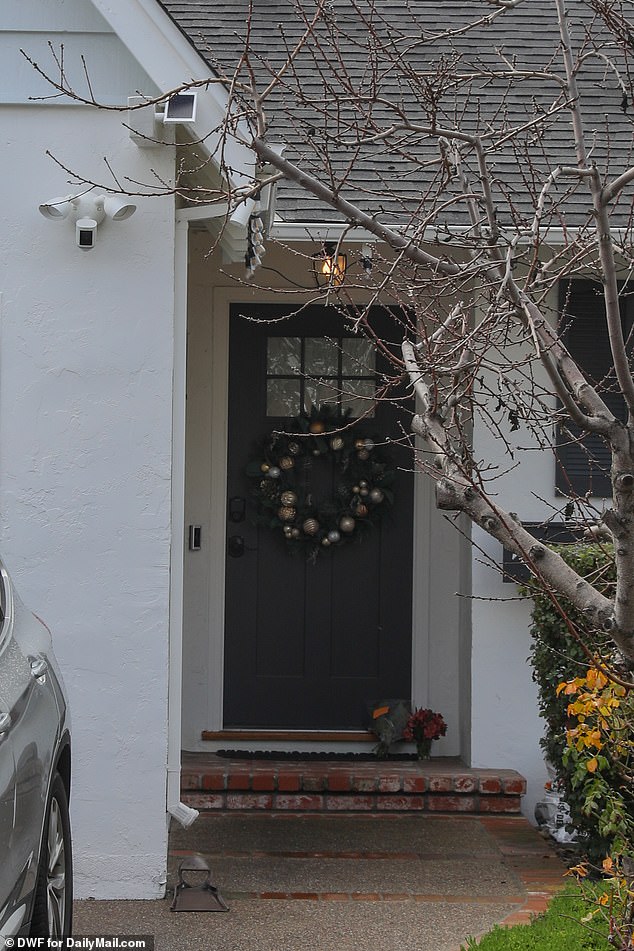 The two-story home, freshly painted with a manicured lawn and shrubs, is located in a quiet residential neighborhood in Silicon Valley