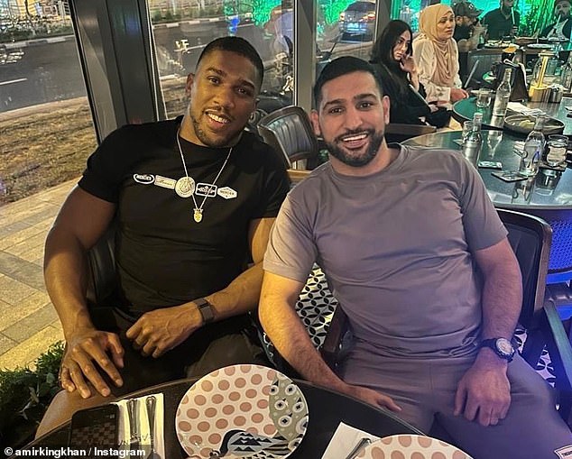 Anthony Joshua (left) and Amir Khan (right) in Dubai