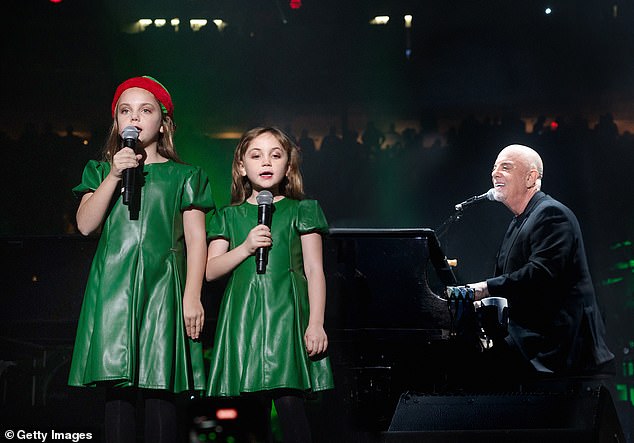 Joel's daughters Della, eight, and Remy, six, sang a stirring rendition of Jingle Bells with their father at Madison Square Garden last month