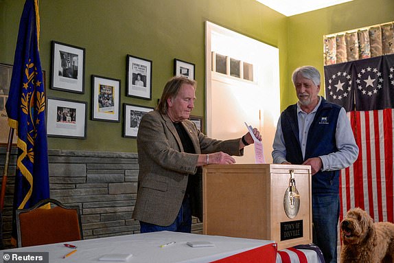 Town Moderator Tom Tillotson votes after midnight on U.S. presidential election day in the living room of the Tillotson House at the Balsams Hotel in Dixville Notch, New Hampshire, U.S., January 23, 2024. REUTERS/Faith Ninivaggi