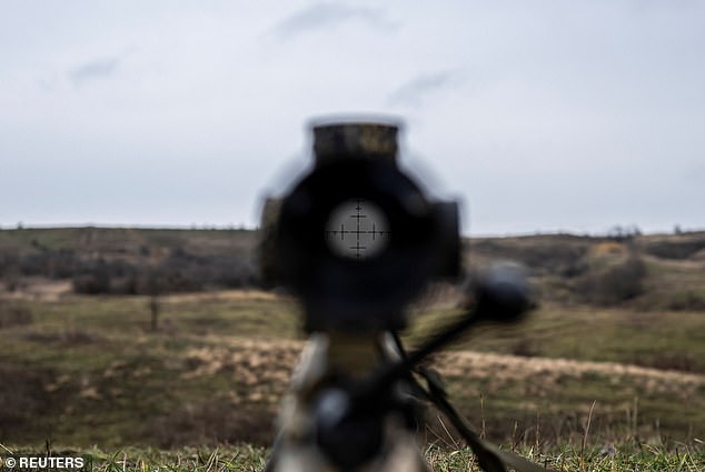 A view shows an optical sight on a rifle of a Ukrainian Army sniper at a shooting range near a front line, amid the Russian attack on Ukraine, in the Donetsk region, Ukraine, December 23, 2023