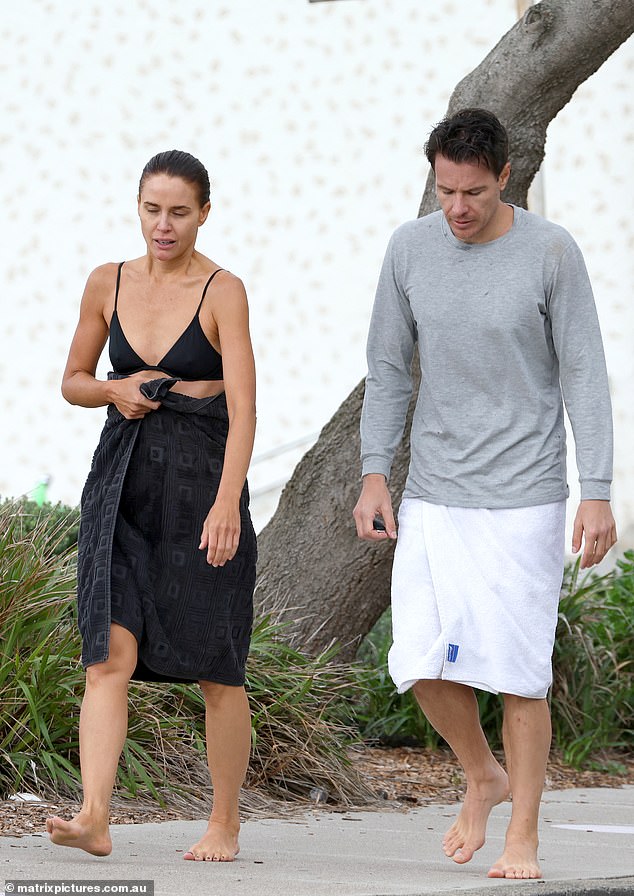 The Queensland-born star appeared in good spirits as she walked along the beach with her handsome male companion and the pair appeared engrossed in conversation