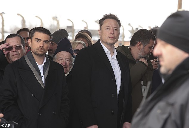 Musk pictured next to Shapiro at the site of the Nazi German Auschwitz-Birkenau death camp in Oswiecim, Poland