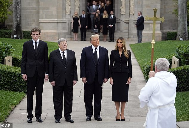 The family walks slowly toward the church as Secret Service agents looked on during the funeral last week