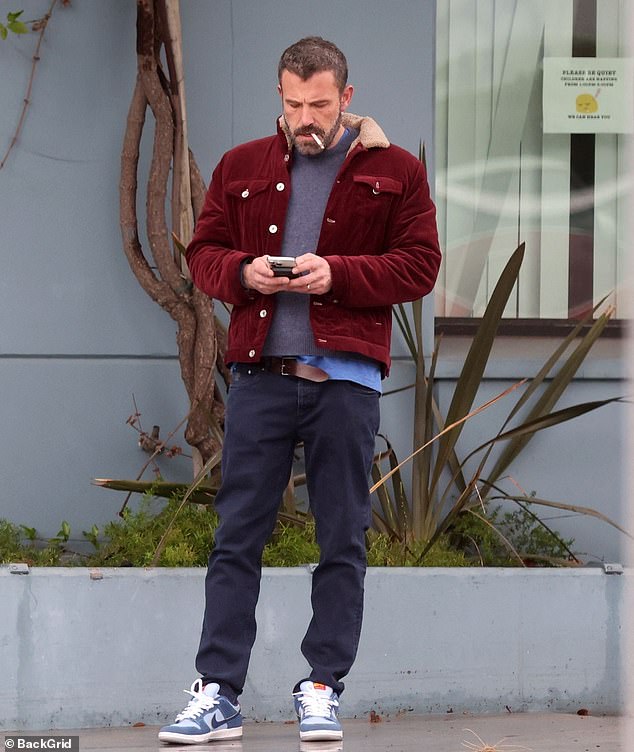 Elsewhere on Tuesday, Jennifer's husband Ben Affleck was spotted taking a smoke break while out and about in a casual outfit in rainy Los Angeles.