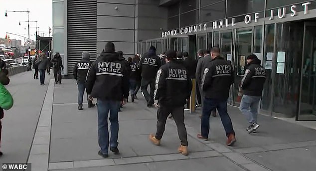 A group of NYPD officers were seen outside the Bronx courtroom Tuesday in support of Duran