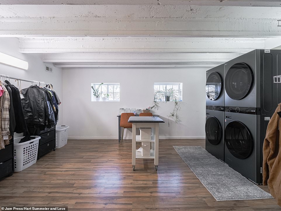 There is also a utility room with two washing machines, two dryers and plenty of space for shoes and coat racks