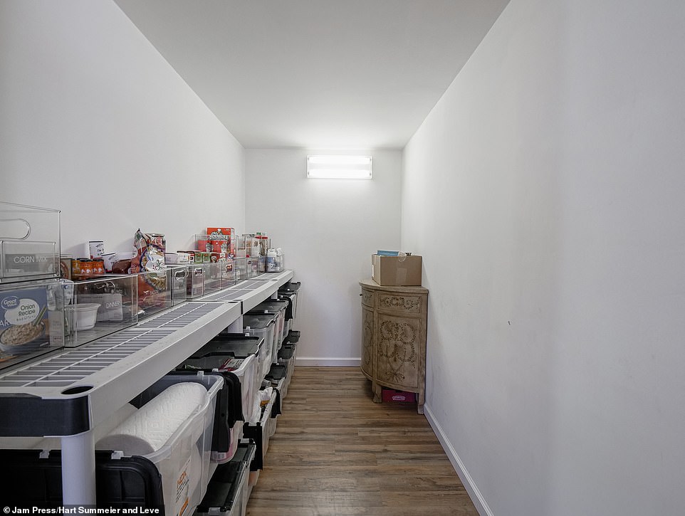 The pantry provides organized and elegant storage space, which can also be continued on the opposite wall if necessary