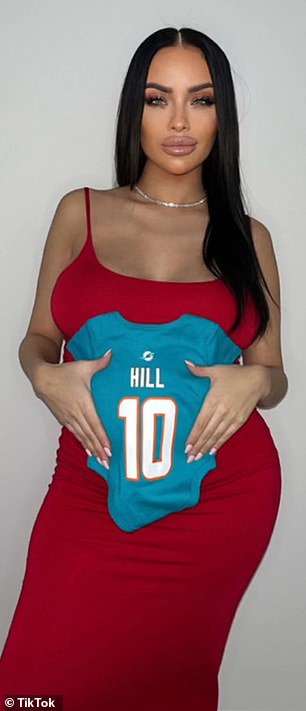 Brittany Lackner, the first of Hill's two new baby mamas, came forward in January, saying she and Hill had sex in Florida last year and that she was due to give birth within days.  She is shown holding a Hill's Dolphin's sweater onesie