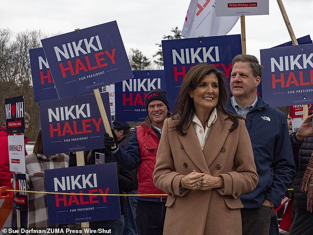 Former UN Ambassador.  Nikki Haley (left) greets supporters next to New Hampshire Governor Chris Sununu at a polling place in Bedford, New Hampshire