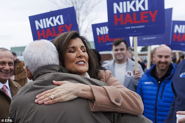 Republican presidential candidate Nikki Haley hugs a supporter outside Winnacunnet High School in Hampton, New Hampshire, on Tuesday