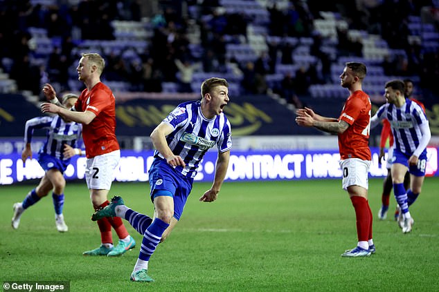 Wigan Athletic's Charlie Hughes scored the winner in the 20th minute of stoppage time