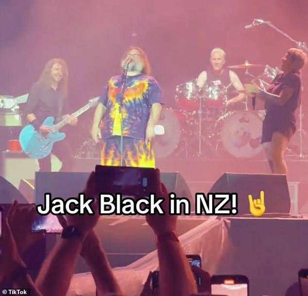 In clips shared to several TikTok accounts over the weekend, the musician was seen rolling around on stage before belting out a cover of the AC/DC hit Big Balls.